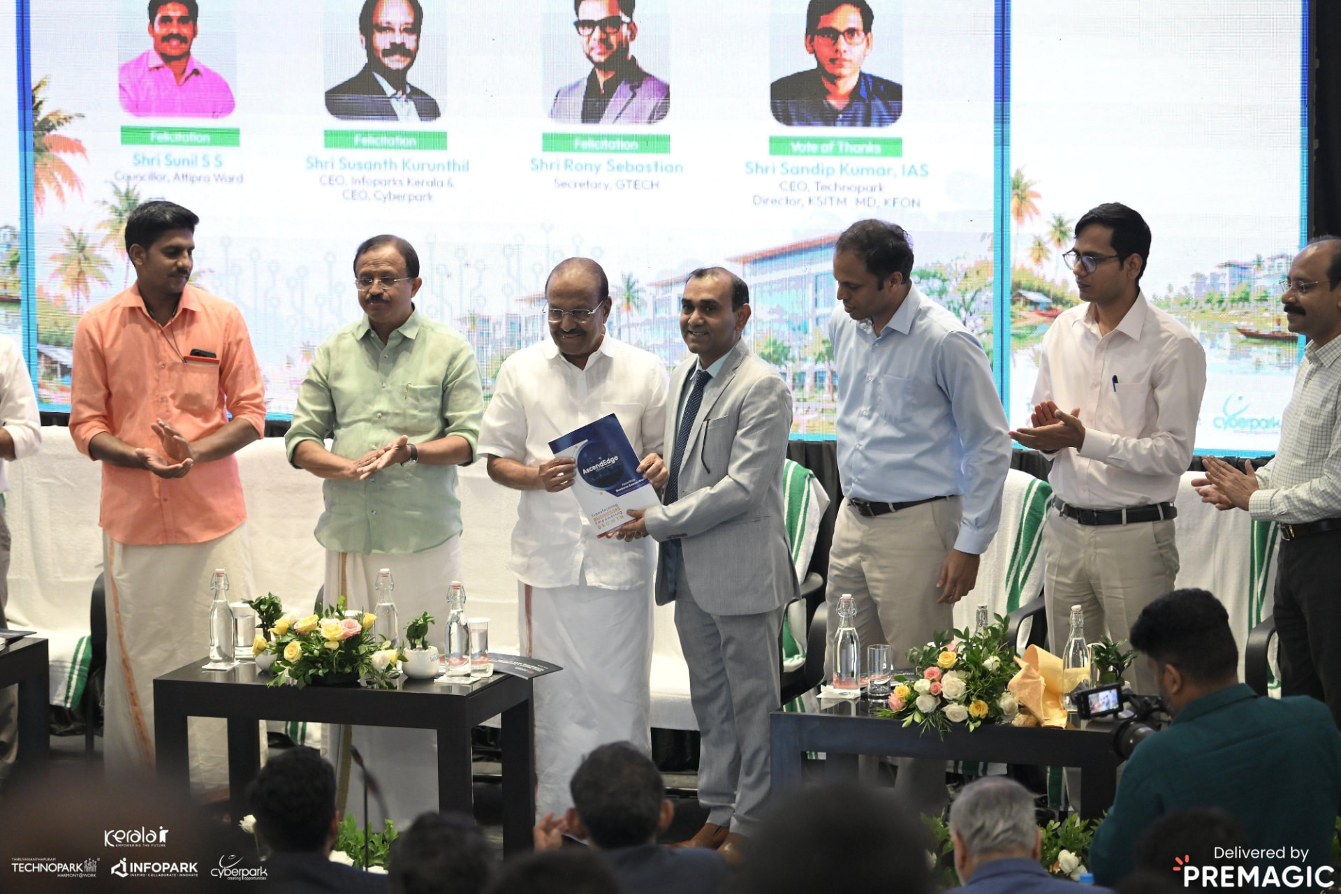 The report handover before a packed hall at the Kerala GCC Outlook 2026 launch.